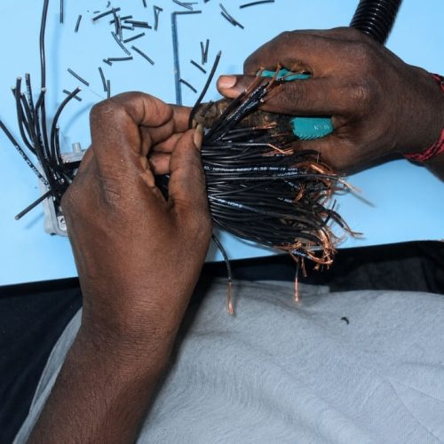 harness assembly worker hands